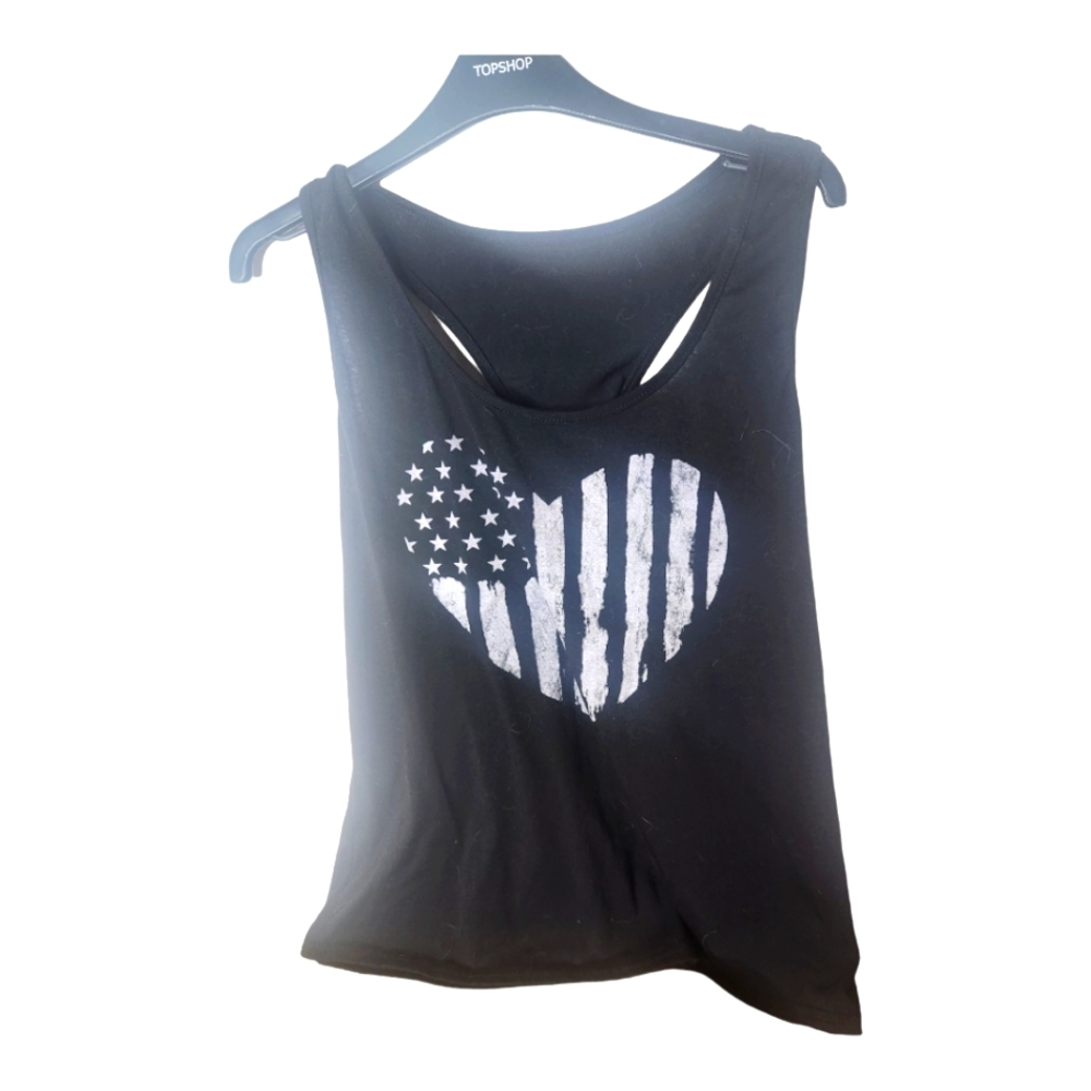 Black large tank top that has a big flag heart on front